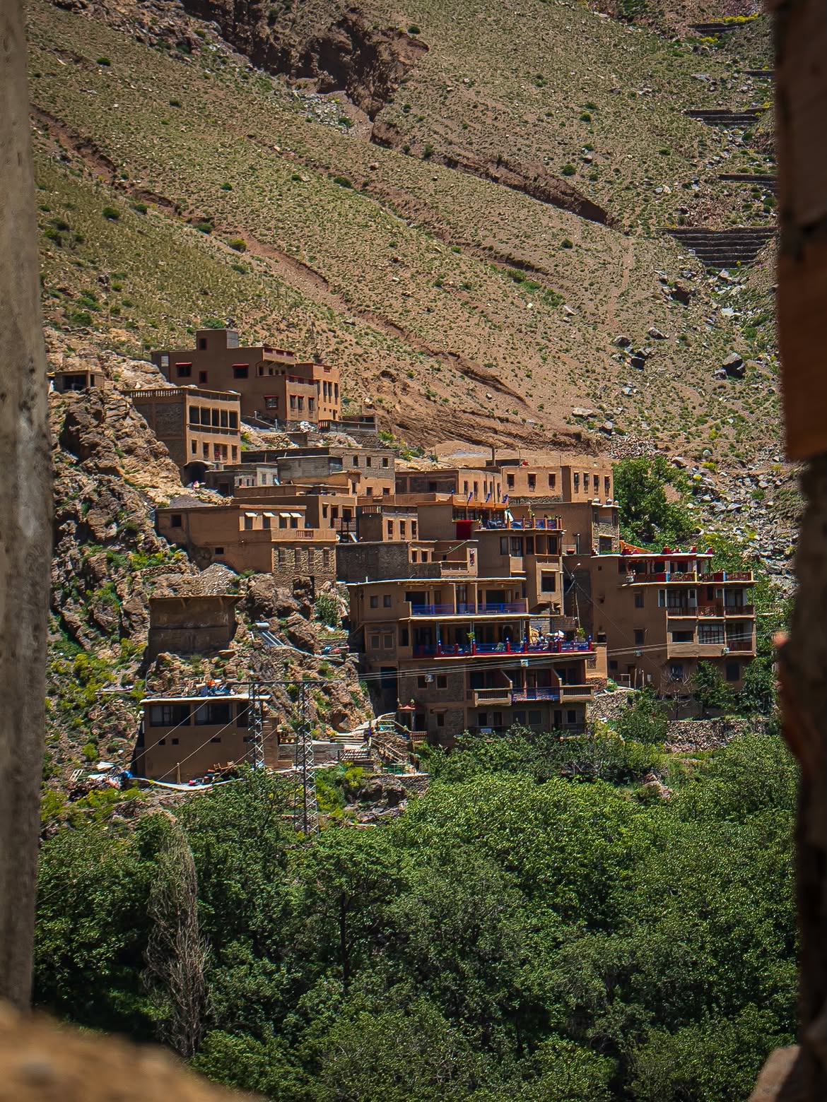 Berber village below the snow-capped High Atlas mountains in Morocco