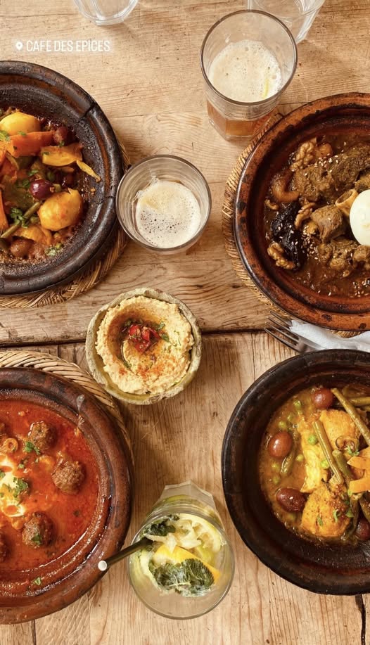 Moroccan food: tagine, mint tea and fresh bread on a low table